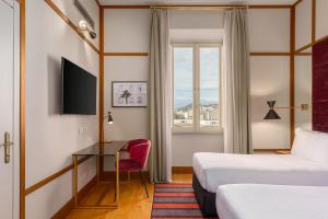 Cama ou camas em um quarto em Room Mate Luca, Florence