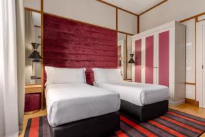 Cama ou camas em um quarto em Room Mate Luca, Florence