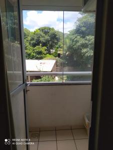 an open door to a room with a window at Condomínio residencial DIROMA RIO QUENTE in Rio Quente