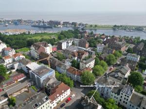 an aerial view of a city with a body of water at Kaiser Apartment am Meer 1 in Wilhelmshaven