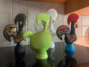 a group of vases with birds on a wall at A Casa do Lagar in Azeitao