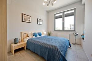 Łóżko lub łóżka w pokoju w obiekcie Wygodny apartament w Pucku