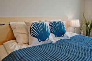 Łóżko lub łóżka w pokoju w obiekcie Wygodny apartament w Pucku