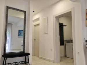 a mirror on a wall in a room with a chair at Villa DE Luna Istra,whirlpool in Barban +42 photos