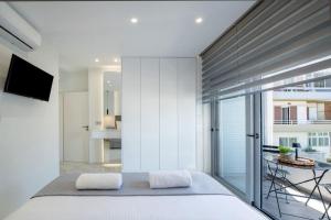 Ένα ή περισσότερα κρεβάτια σε δωμάτιο στο Rhodes Center Luxury Suite