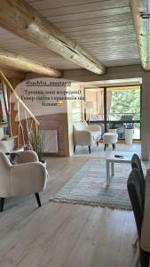 a living room with chairs and a table at Provence in Slavske