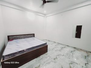 Voodi või voodid majutusasutuse Raghubir Nikunj Homestay toas