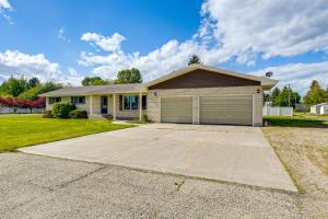 a large house with a garage at Idaho Vacation Rental Day Trip to Yellowstone! in Sugar City