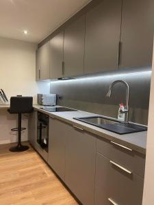 a kitchen with a sink and a counter top at City apartment in Pärnu