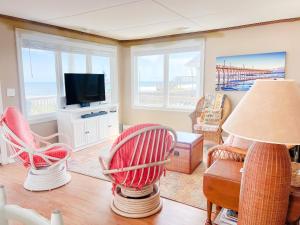 a living room with a view of the ocean at Lungomare in Surf City