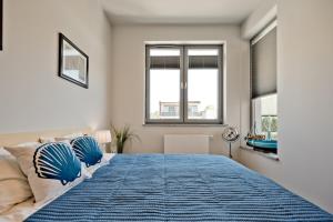 Łóżko lub łóżka w pokoju w obiekcie Wygodny apartament w Pucku