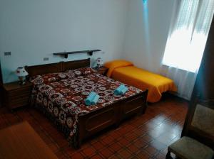 Ліжко або ліжка в номері Albergo Belvedere