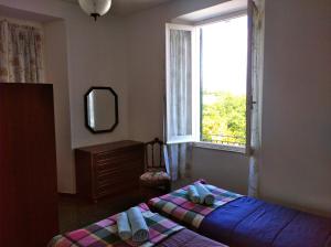 Ліжко або ліжка в номері Albergo Belvedere