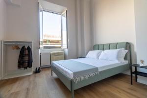 Postel nebo postele na pokoji v ubytování Joe Litty Rooms