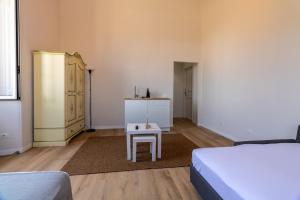 Postel nebo postele na pokoji v ubytování Joe Litty Rooms