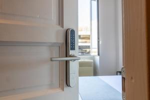 Postel nebo postele na pokoji v ubytování Joe Litty Rooms