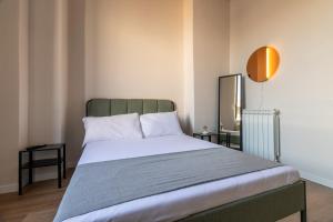Postel nebo postele na pokoji v ubytování Joe Litty Rooms