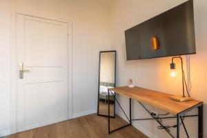 TV a/nebo společenská místnost v ubytování Joe Litty Rooms