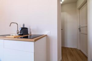 Kuchyň nebo kuchyňský kout v ubytování Joe Litty Rooms