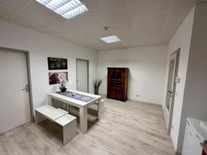 a white room with a table and a bench in it at Kobra Room in Spielberg in Spielberg
