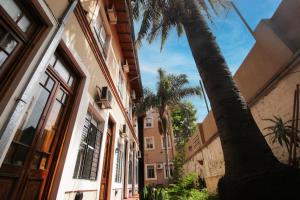 a palm tree in front of a building at Puerto Delta in Tigre