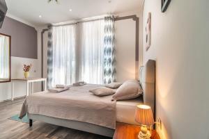 Postel nebo postele na pokoji v ubytování Giovanna Boutique Rooms & Pool