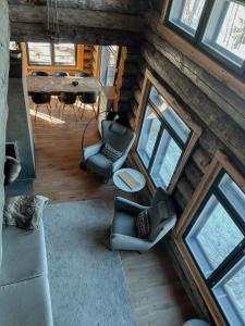 an overhead view of a living room with a table and chairs at Villa Karhukumpu in Ivalo