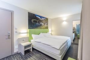 Krevet ili kreveti u jedinici u okviru objekta Adhhoc Hotel