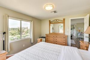 a bedroom with a bed and a dresser and a mirror at Escondido Vineyard Estate Walk to Wineries! in Escondido