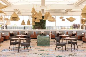 a rendering of a restaurant with tables and chairs at River Lodge Paso - 21 & Over Pool in Paso Robles