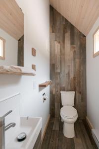 a bathroom with a toilet and a sink at Le Chalet Waterfront Retreat in Ucluelet