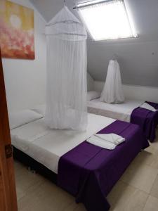 Postel nebo postele na pokoji v ubytování LA MESA CUND, APTO CONJUNTO GETSEMANI