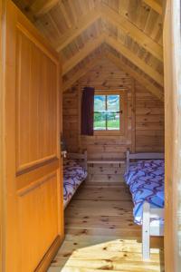 Un pat sau paturi într-o cameră la Maple bungalows