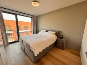 Postel nebo postele na pokoji v ubytování Casa Matti - Modern Apartment with Garden View and Terrace
