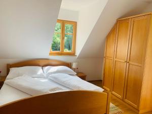 Postel nebo postele na pokoji v ubytování Apartments Grabenmühle