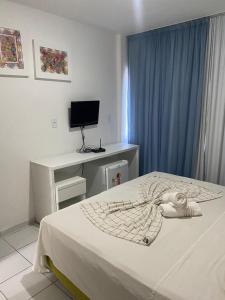 Postel nebo postele na pokoji v ubytování Pousada Mar de Maceió