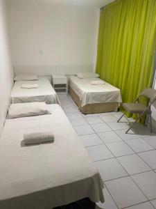 Postel nebo postele na pokoji v ubytování Pousada Mar de Maceió
