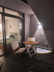 a table and two chairs in a room with a bed at Romantic Cozy Studio Bali Gouna in Hurghada