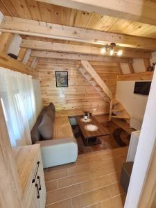 a living room with a couch and a table at Bungalow Kalina in Žabljak