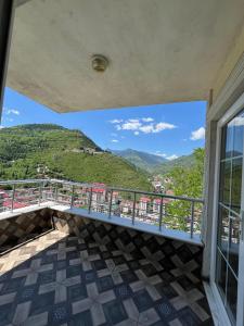 a balcony with a view of the mountains at Yavuz Luxury Apartments in Macka