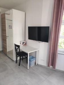 TV a/nebo společenská místnost v ubytování Apoteka