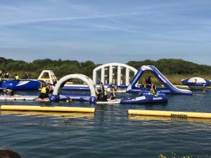 a group of people playing in a water park at Miller's Cottage in Woolfardisworthy