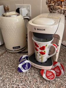 a coffee maker sitting on top of a counter at Miller's Cottage in Woolfardisworthy