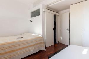 Cama o camas de una habitación en Casa Fellini nel Borgo di San Giuliano