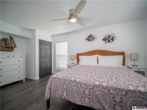 a bedroom with a bed and a ceiling fan at Casa Andante - Lakefront Escape in Mayville