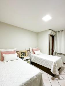Postel nebo postele na pokoji v ubytování Porty Brasil Hotel