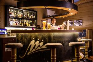 Ο χώρος του lounge ή του μπαρ στο Hotel Maximilian