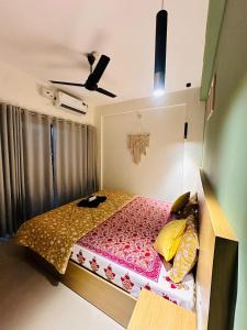 a small bedroom with a bed with at 1 BHK Fully Furnished - Soorya Madhavam Apartments - Flat No - C2 - Guruvayur, - 150m to North Nada - Family only in Guruvāyūr +12 photos
