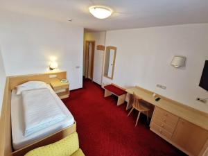 Posteľ alebo postele v izbe v ubytovaní Hotel la Plaza