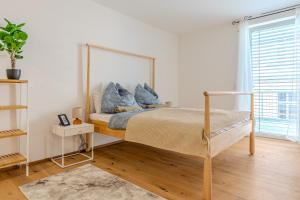 Ένα ή περισσότερα κρεβάτια σε δωμάτιο στο Krems Deluxe Apartments - Newly built